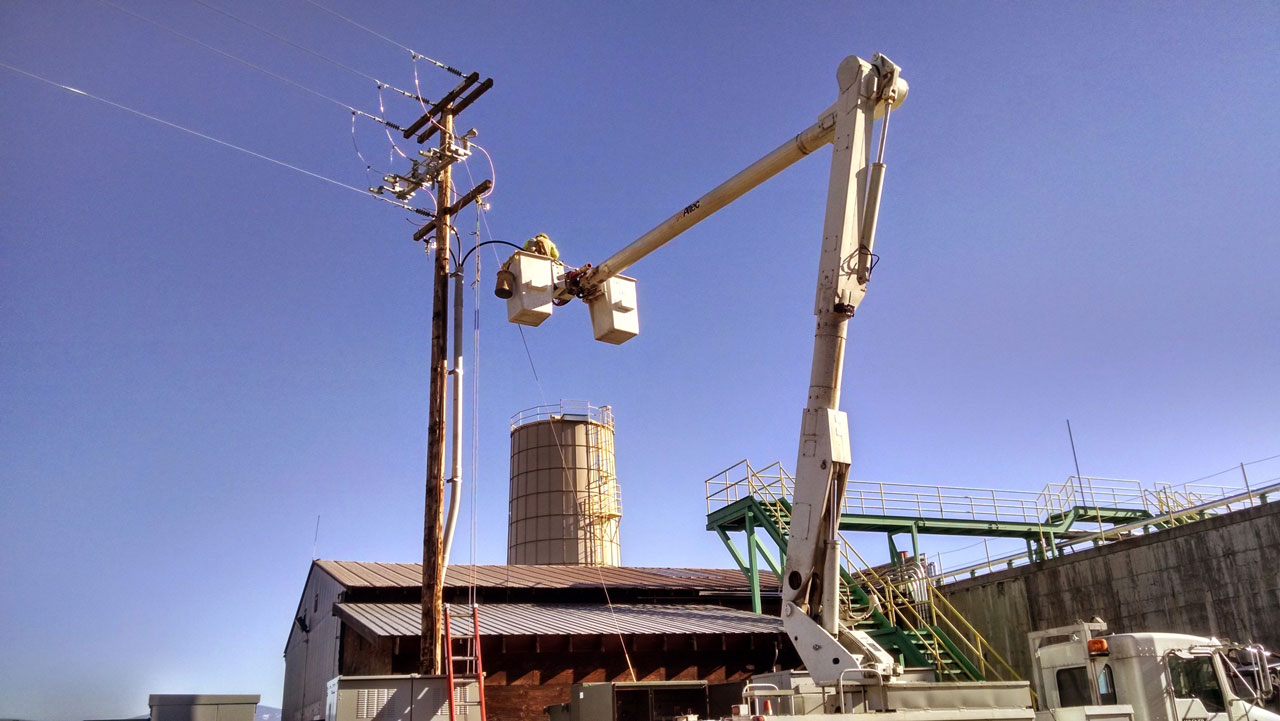 Bullert Working on Electric Pole for Timber Products Project